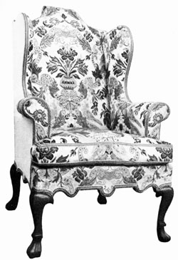 PLATE VII - finely-designed wing chair
